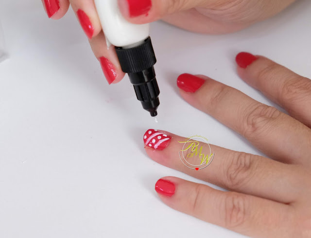 a photo of How to do dots nail art design