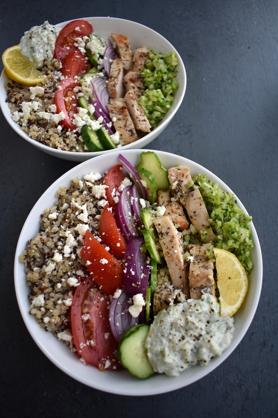 Greek Chicken Meal Prep Bowls are loaded with lemon herb chicken, tzatziki sauce, cucumbers, tomatoes, red onion, feta and broccoli for the perfect lunch that can be made ahead of time! www.nutritionistreviews.com