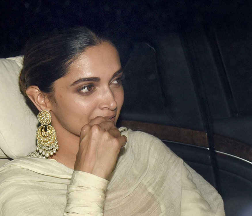 Ranveer Singh and Deepika Padukone get clicked as they arrive at the special screening of