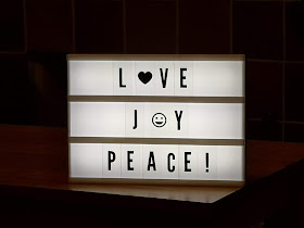 Light box saying love, joy and peace