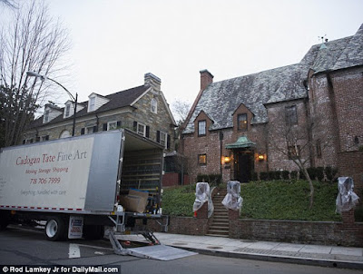 1a Moving vans seen arriving at $4.3m DC mansion where the Obama family will live