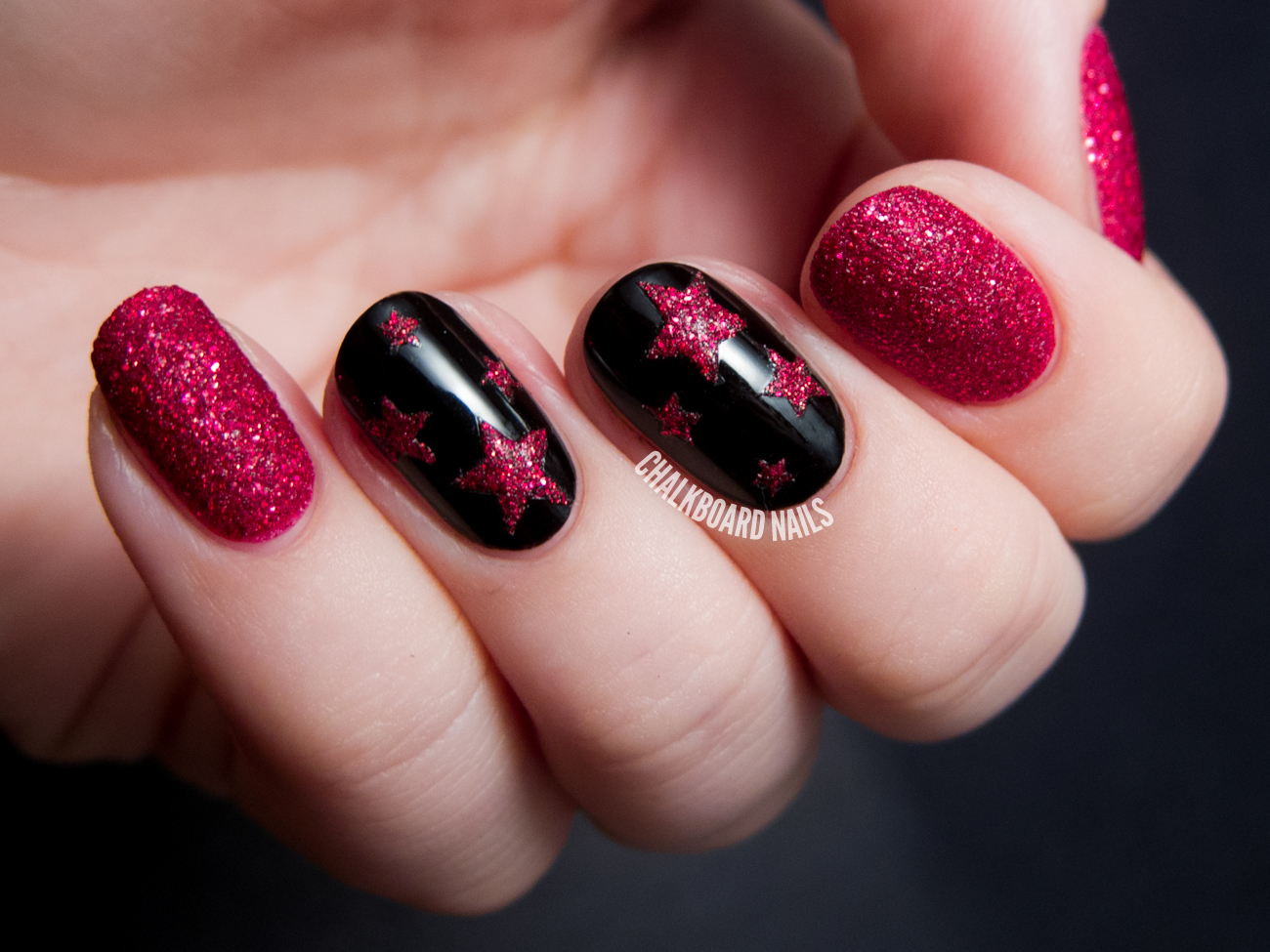 Textured ruby stars by @chalkboardnails