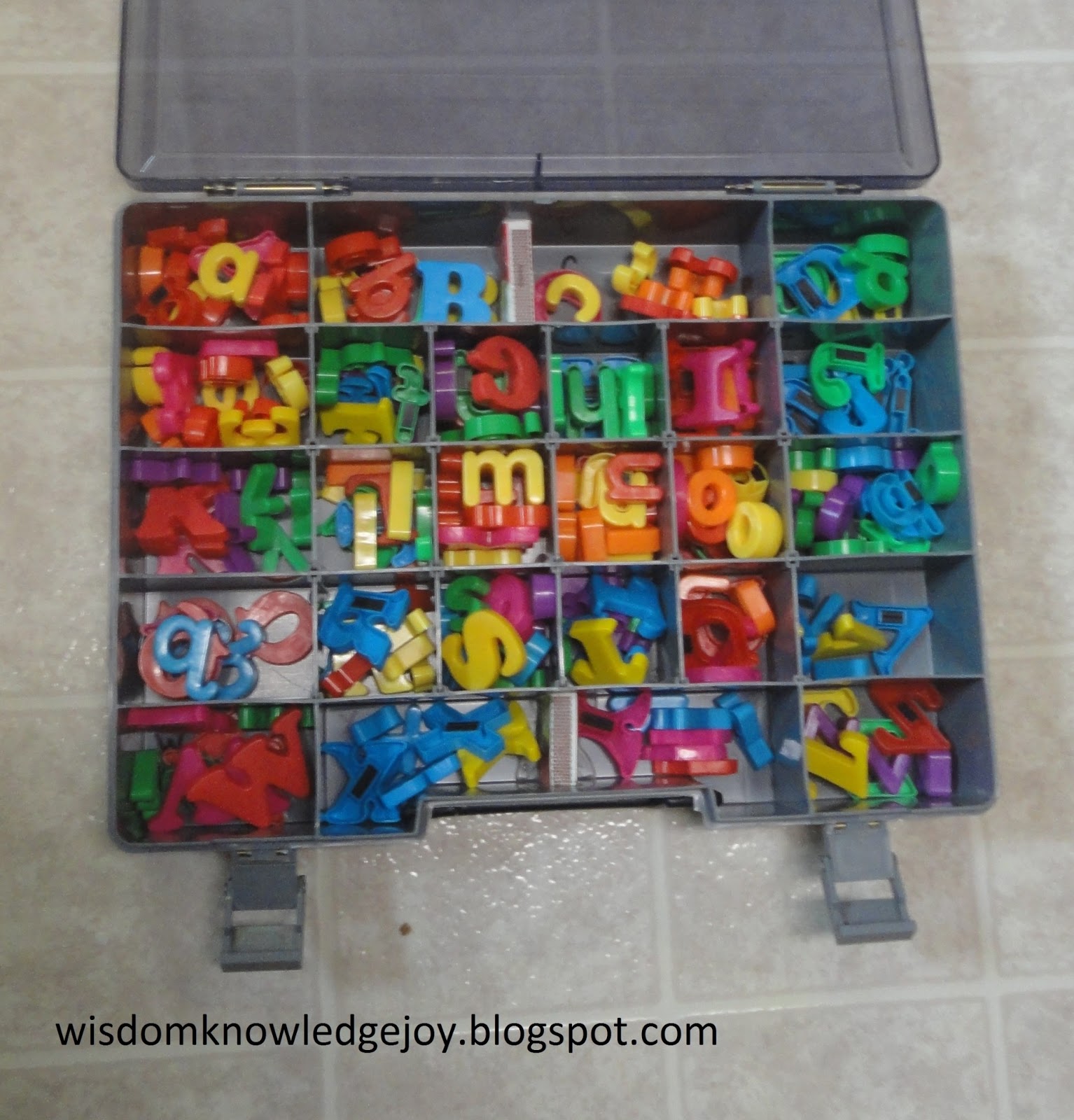 Wisdom. Knowledge .Joy Travel friendly storage for alphabet letters.