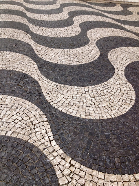 Cobblestone street patterns in Lisbon on Semi-Charmed Kind of Life