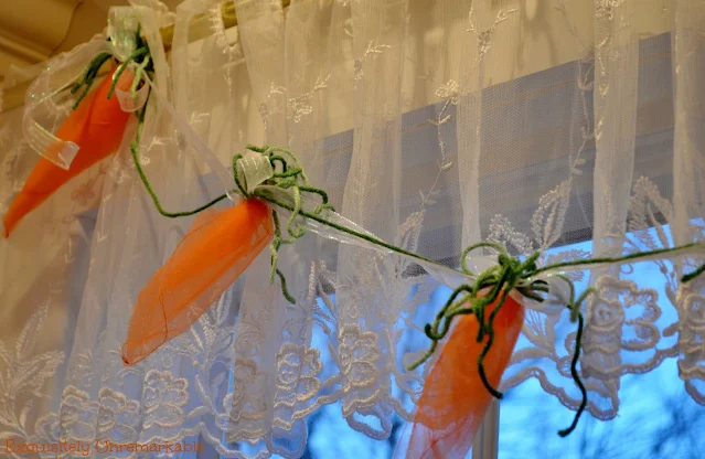 Carrot And Ribbon Tulle Garland hanging over a window