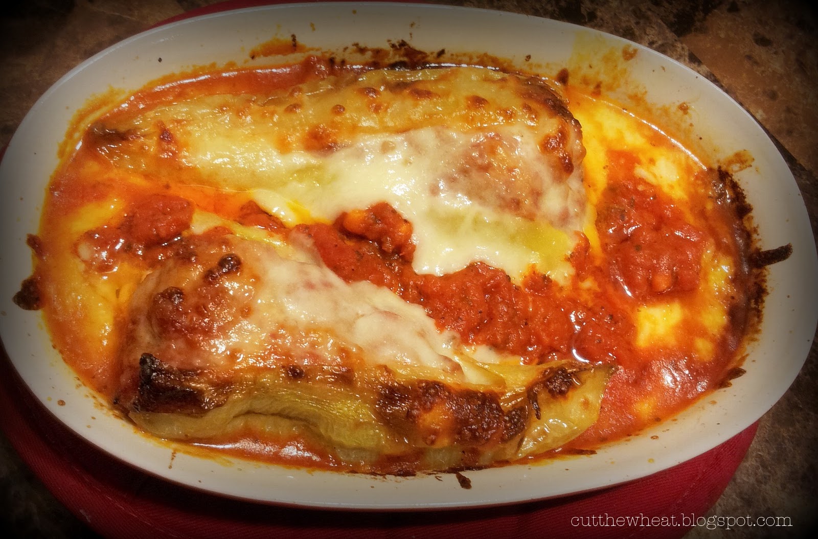 Hot Sausage Stuffed Banana Peppers with Tomato Sauce and Melted Cheese
