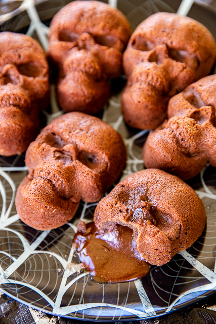 Chocolate Lava Skull Cakes - seriously delicious and PERFECT for your Halloween parties! Only 5 simple ingredients - chocolate chips, butter, eggs, powdered sugar, flour. They only take a minute to whip up and are ready to eat in about 15 minutes. Serve the cakes with some whipped cream and/or vanilla ice cream. Delicious and frightfully festive!! #halloween #chocolate #chocolatelavacake #cake #quickdessert Chocolate Lava Skull Cakes - seriously delicious and PERFECT for your Halloween parties! Only 5 simple ingredients - chocolate chips, butter, eggs, powdered sugar, flour. They only take a minute to whip up and are ready to eat in about 15 minutes. Serve the cakes with some whipped cream and/or vanilla ice cream. Delicious and frightfully festive!! #halloween #chocolate #chocolatelavacake #cake #quickdessert