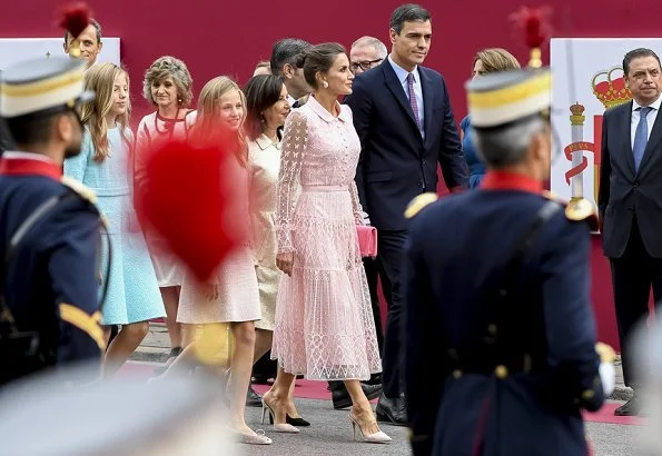 Queen Letizia wore a new pink embroidered tulle midi dress by Felipe Varela. Crown Princess Leonor and Infanta Sofia