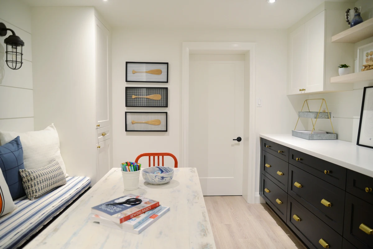 modern coastal craft room Home Depot Canada two tone cabinetry, shiplap walls and nautical decor