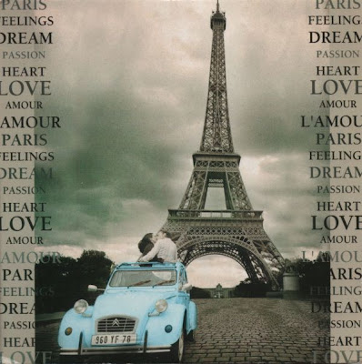 Pale blue 2CV beside the Eiffel Tower, with couple kissing