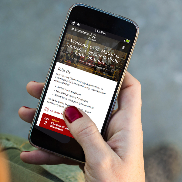 a parishioner checks the St. Matthias homepage using her smartphone to get details about an upcoming event at the church