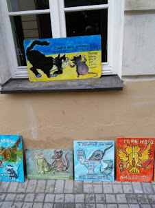 Hilarious "CAT CARTOON" paintings and posters on sale in Vilnius.