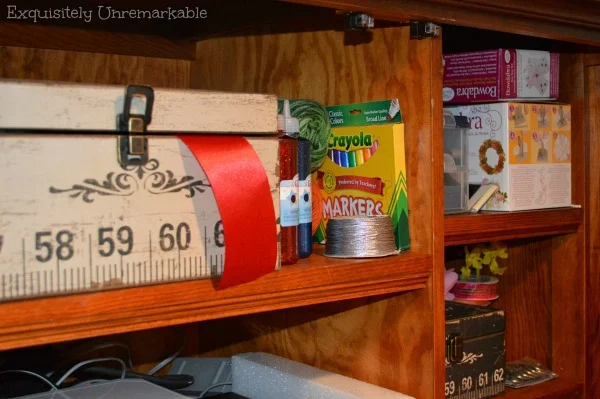 Craft supplies in an armoire