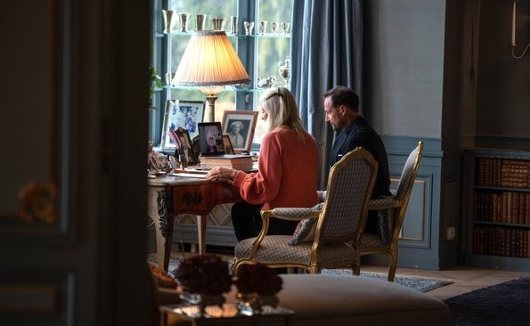 Crown Prince Haakon and Crown Princess Mette-Marit contacted with Norwegian Council for Mental Health. pink sweater