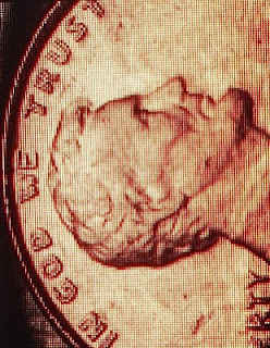 image of a penny with 'In God We Trust'
