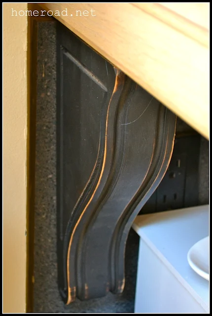 wooden corbels from the thrift store repurposed as kitchen corbels.