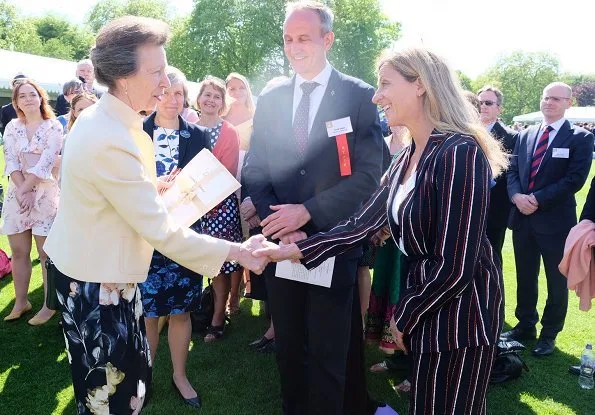 The Princess Royal and Princess Beatrice. Princess Anne wore a floral dress