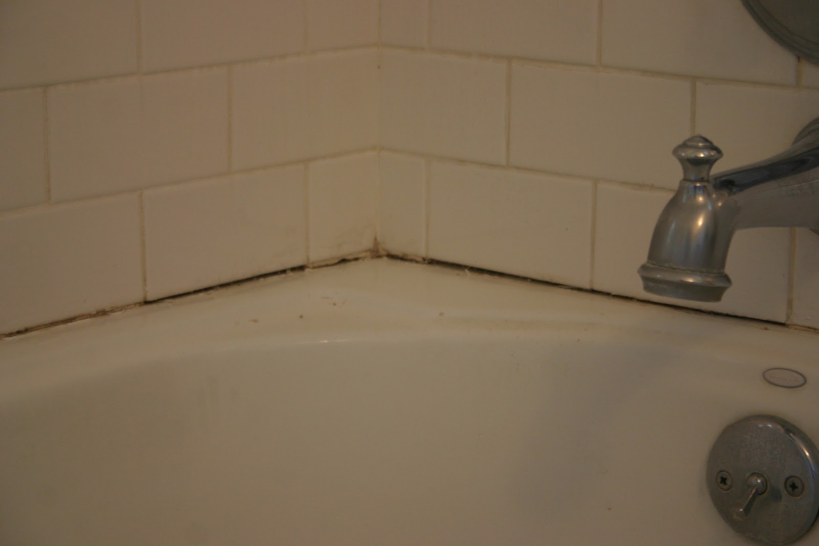 re caulking the bathtub The Gardener's Cottage