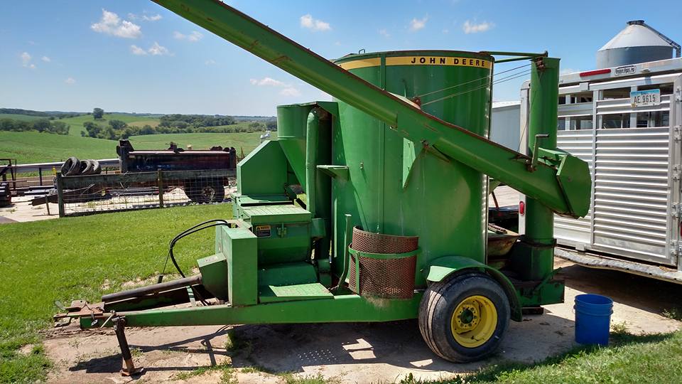 Industrial History Tractor implement to grind, mix, and deliver feed