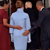 See the un-photoshopped photo of Obama holding Melania Trump