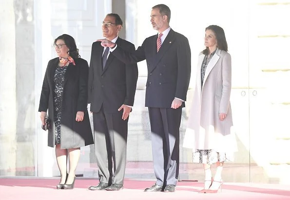 Queen Letizia wore Massimo Dutti snakeskin print dress with tie belt. Queen Letizia wore a new snakeskin print dress by Massimo Dutti