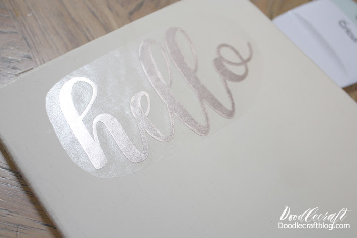 Step 6: Cutting Vinyl Wording Pause the flower making festivities to put the vinyl on the wood board.  Use a Cricut Maker or other cutting machine to cut your desired greeting out of metallic vinyl.    Apply the greeting to the top of the wood board. Mine is a simple Hello!