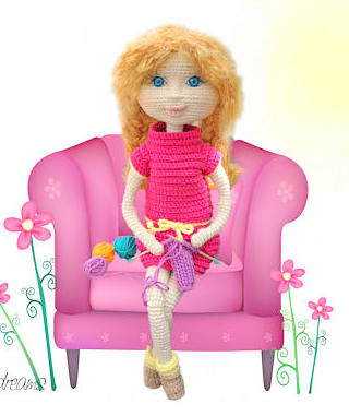 Amigurumi doll, girl knitting sitting on couch