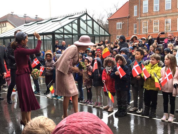 Crown Princess Mary wore Gianvito Rossi pumps, Alexander-McQueen skirt and coat, Prada Brushed Leather Pumps in Dark Red