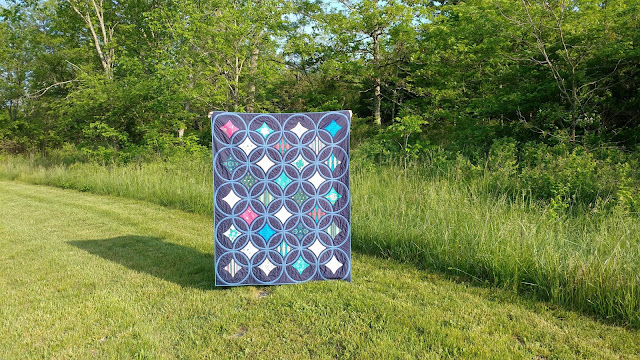 Moonrise quilt by Slice of Pi Quilts using Loved to Pieces fabric by Mathew Boudreax (aka Mister Domestic) for Art Gallery Fabrics