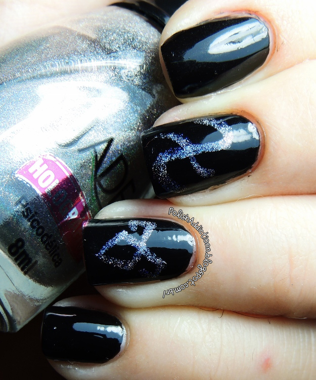 Now to my nails, I used a long thin brush to make the symbols.