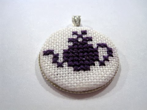 Cross stitched teapot design finished into a necklace