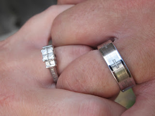 wedding rings on couples hands