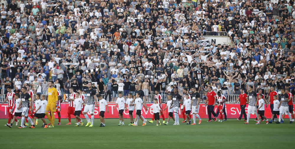 Players of FK Crvena zvezda applaud the fans after the team's