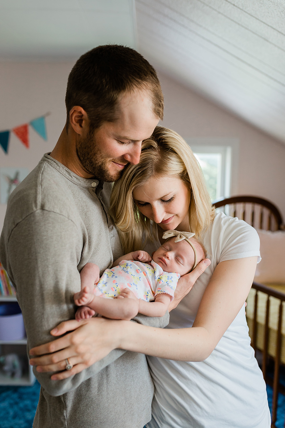Family of three with a newborn baby girl, Idaho Lifestyle Newborn Family Photographer