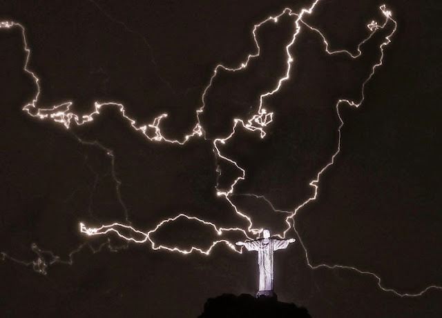 Jesus versus lightning. Statue of Christ the Redeemer in Rio de Janeiro hit by lightning. What SHOULD take home message be? The best Christian vs Atheist debate ever! marchmatron.com Jesus versus lightning. Statue of Christ the Redeemer in Rio de Janeiro hit by lightning. What SHOULD take home message be? The best Christian vs Atheist debate ever! marchmatron.com