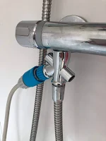 shwing how to attach dog shower to bath
