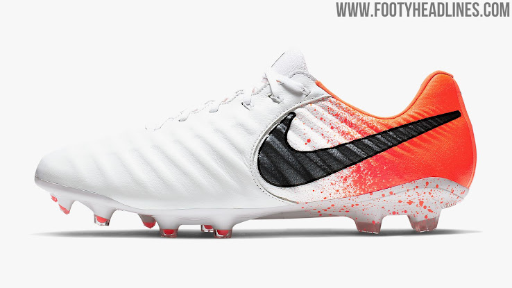 white and orange football boots