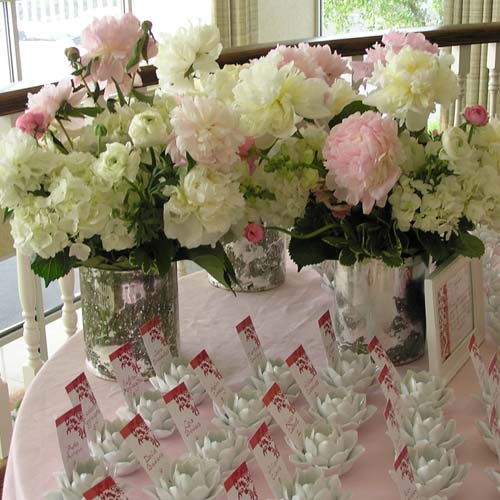  type of flowers and presentation of the wedding floral arrangement being 