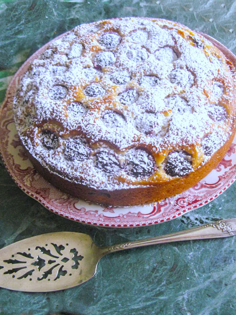 Southern Fresh Cherry Cake, quick and easy deliciously moist cake, made with self rising flour a touch of cornmeal, buttermilk, eggs, and butter.  Serve it plain with a dollop of whip cream or as we did with a dusting of powder sugar.