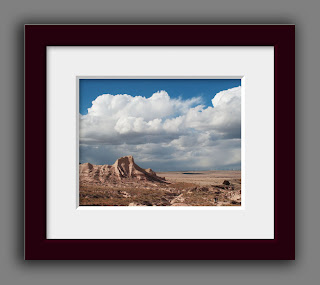 sandy rugged buttes rising under a dramatic stormy spring sky on the High Plains of Colorado