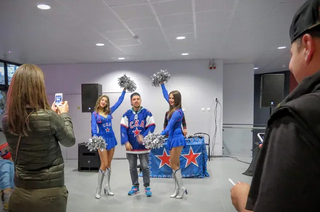 St. Petersburg SKA cheerleaders with a fan