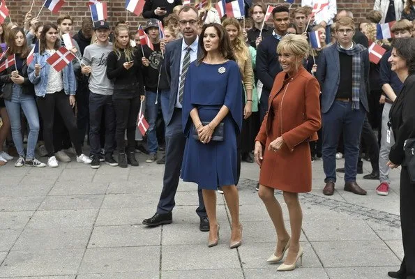 Brigitte Macron wore a dress by Louis Vuitton. Crown Princess Mary wore Stella McCartney cape gown. President Emmanuel Macron