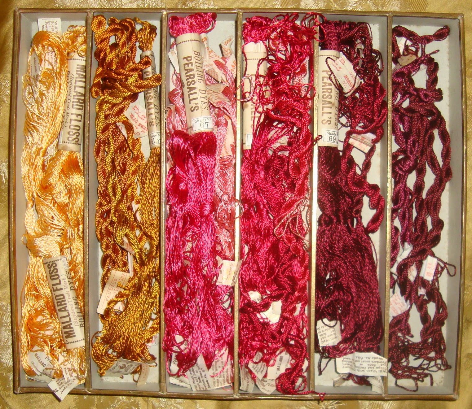 Interesting Antique Textiles A vintage shop display box of embroidery