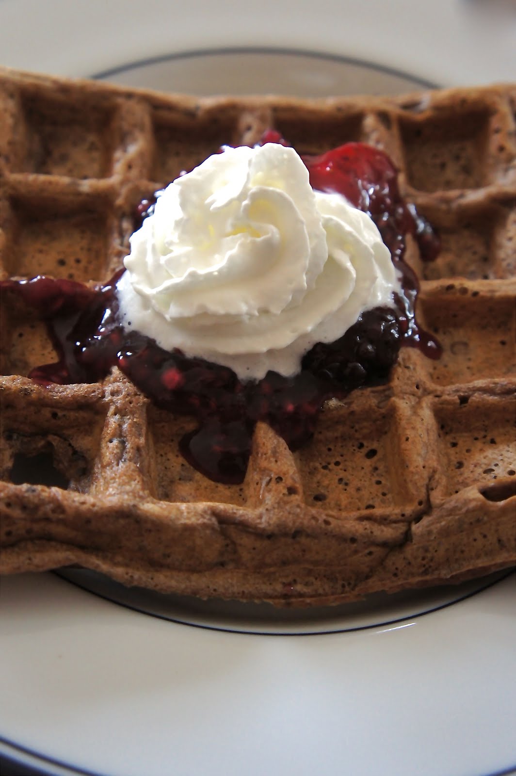 Savory Sweet and Satisfying Chocolate Waffles with Mixed Berry Sauce