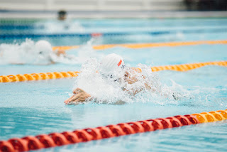 Improve your form 1 Swimming Form: image of a swimmer swmming in a lap lane