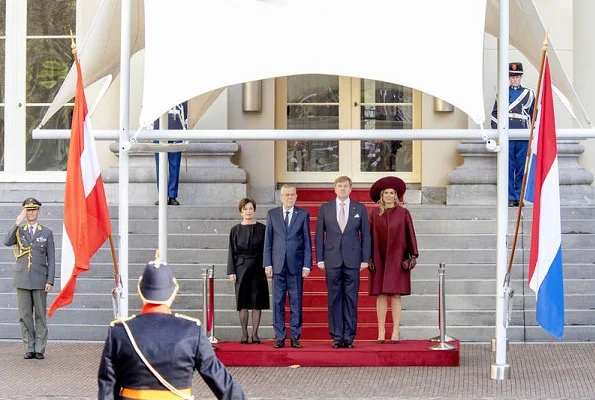 Queen Maxima's new claret red dress are from the 2018 collection of Belgian fashion house Natan. Queen wore her claret red coat by Natan