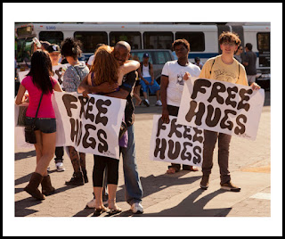 a photo of people giving away free hugs at union square in new york