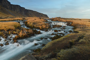 A roadside waterfall