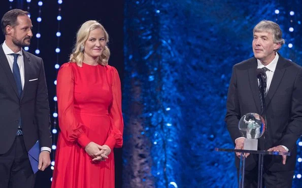 Crown Princess Mette-Marit wore red dress and  Nicholas Kirkwood Lace Pumps. at Olympic Amphitheater