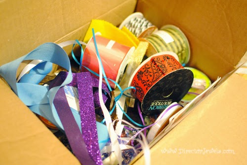 Easy Ribbon Storage Solution: keep spools of ribbon organized with wire hangers. DIY Crafters Crafting Home Organization Tip at directorjewels.com.